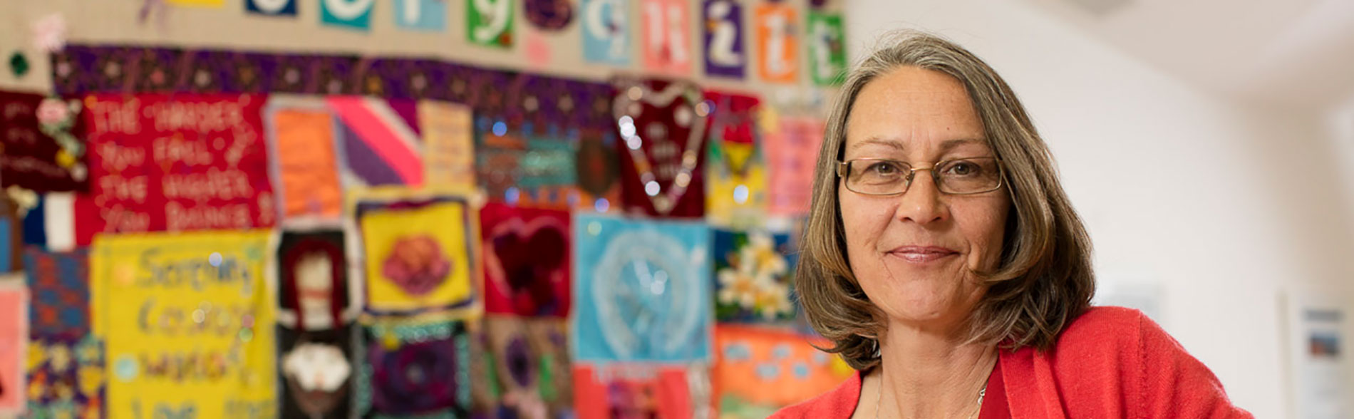 Author Caroline Picton against a colourful background