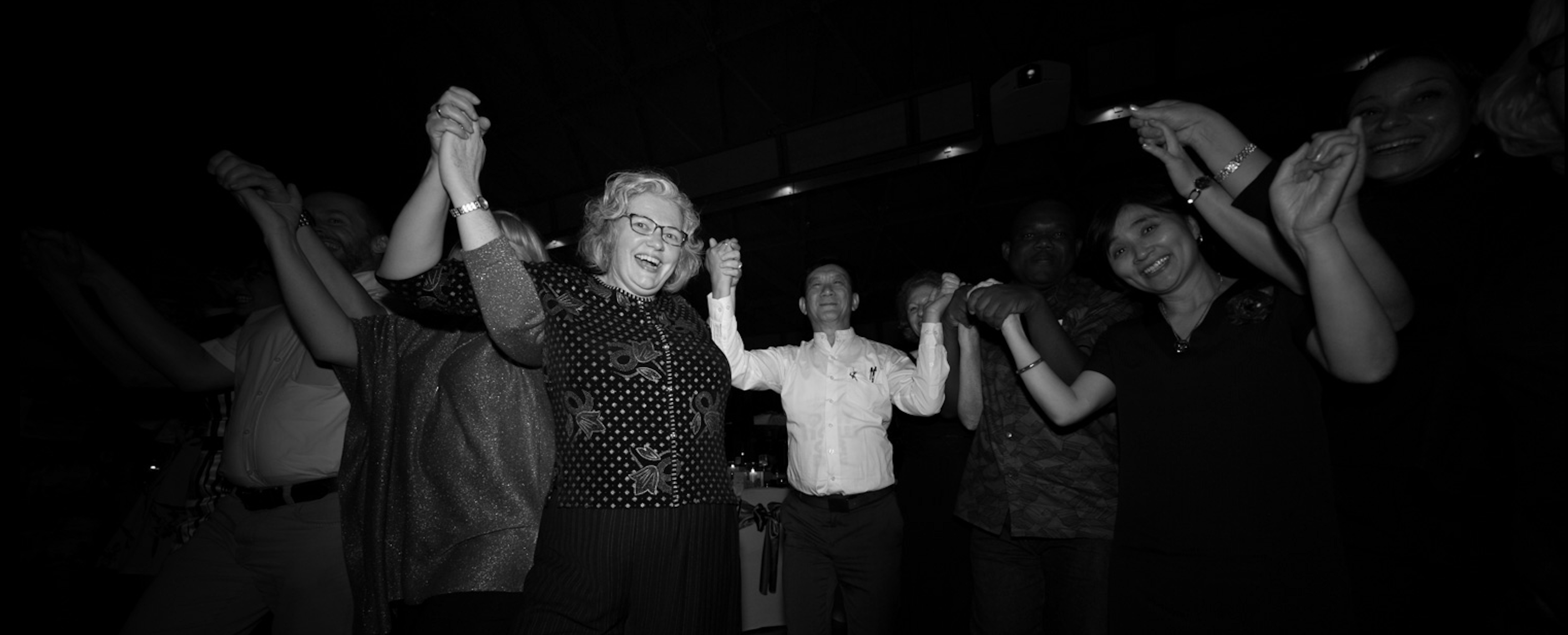 Pam fletcher dances with JBI Collaboration friends