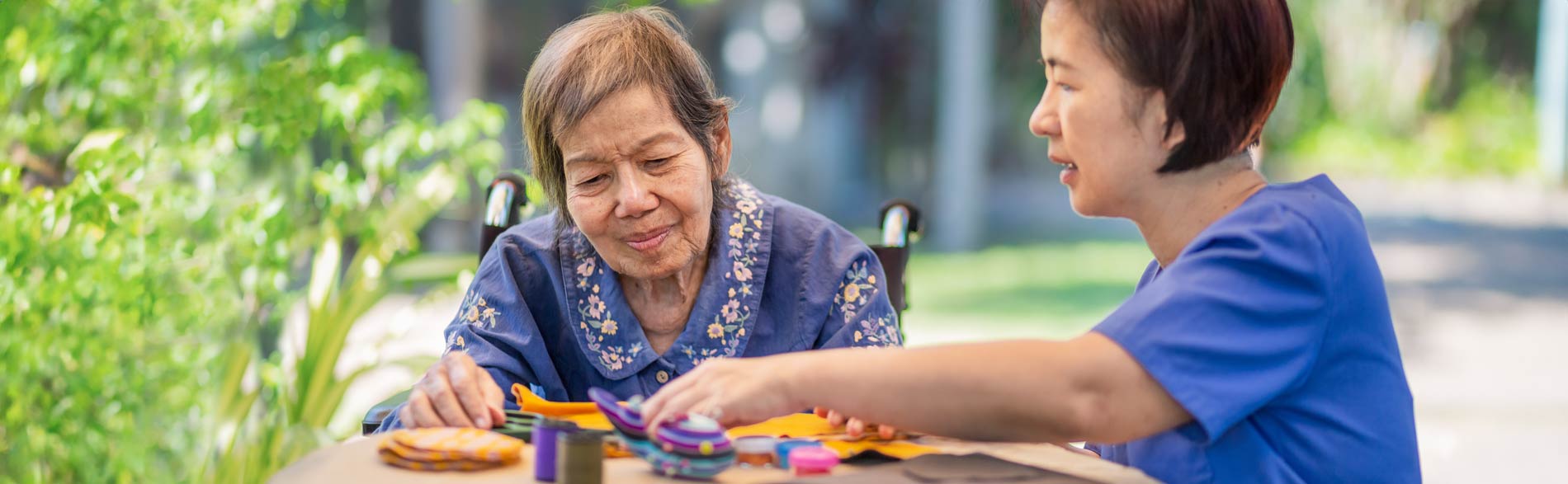 Occupational therapist works with an elderly patient