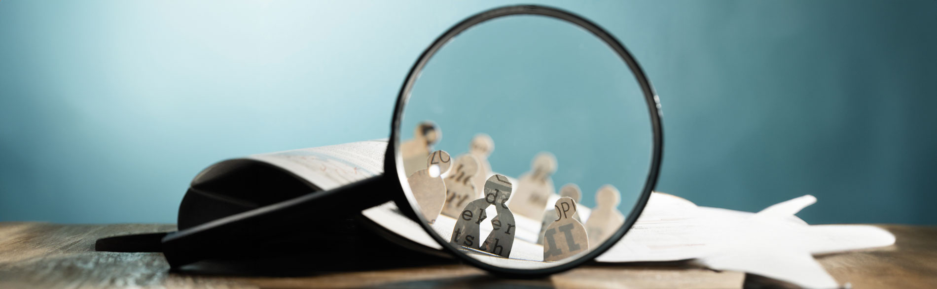 A magnifying glass showing methodology for qualitative systematic reviews