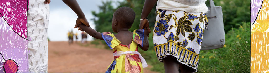 Small child holds the hands of two women as the three of them walk away from camera