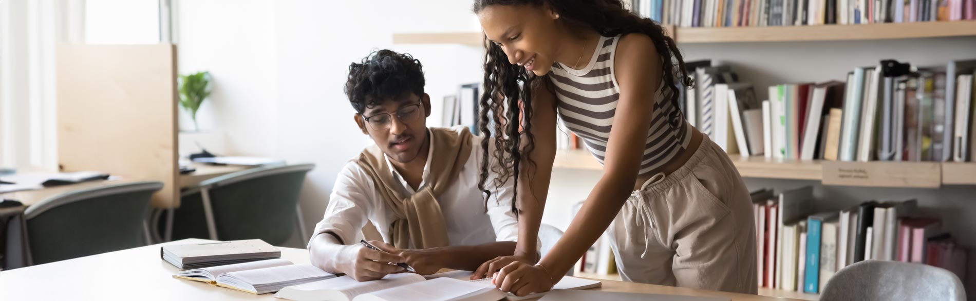 A young man and woman going over research together