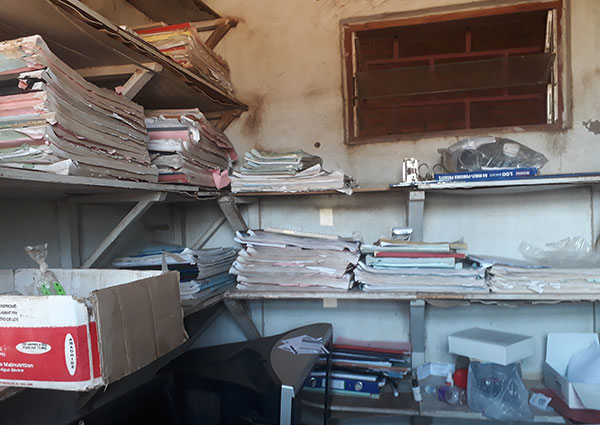 Small room with piles of record books
