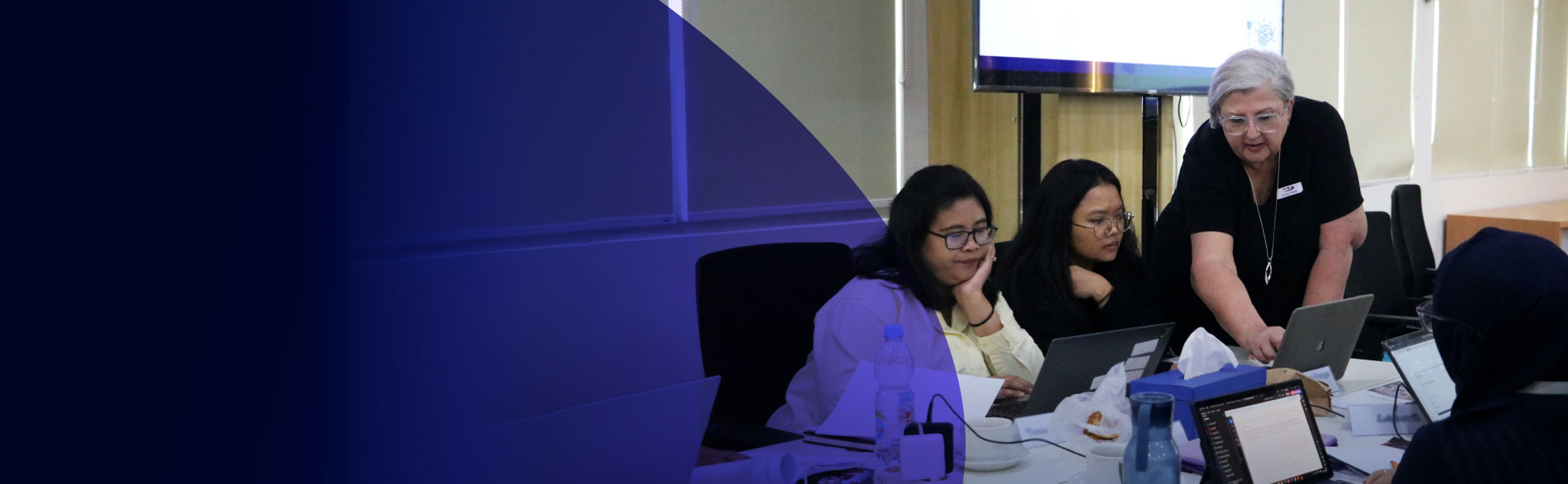 Dr Sonia Hines assists students during a Comprehensive Systematic Review Training Program