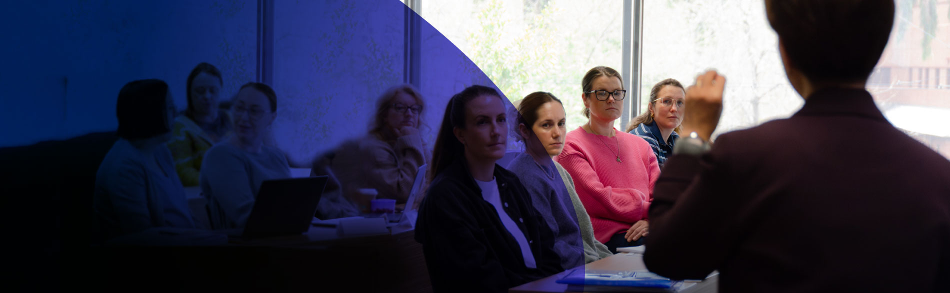 Students listen to Dr Lucy Lizarondo in a JBI Clinical Leadership Workshop