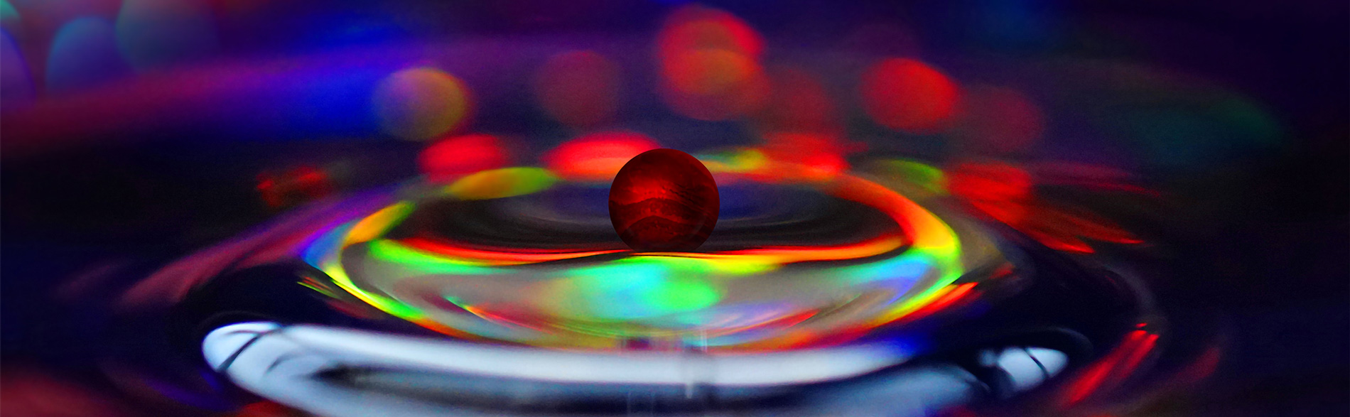 JBI Red pebble causing colourful ripples