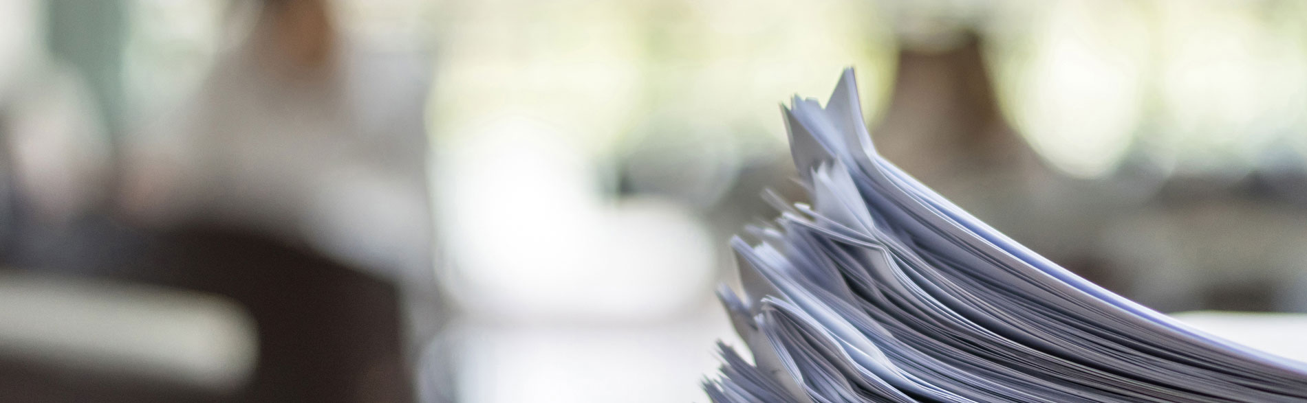 A stack of stapled reports