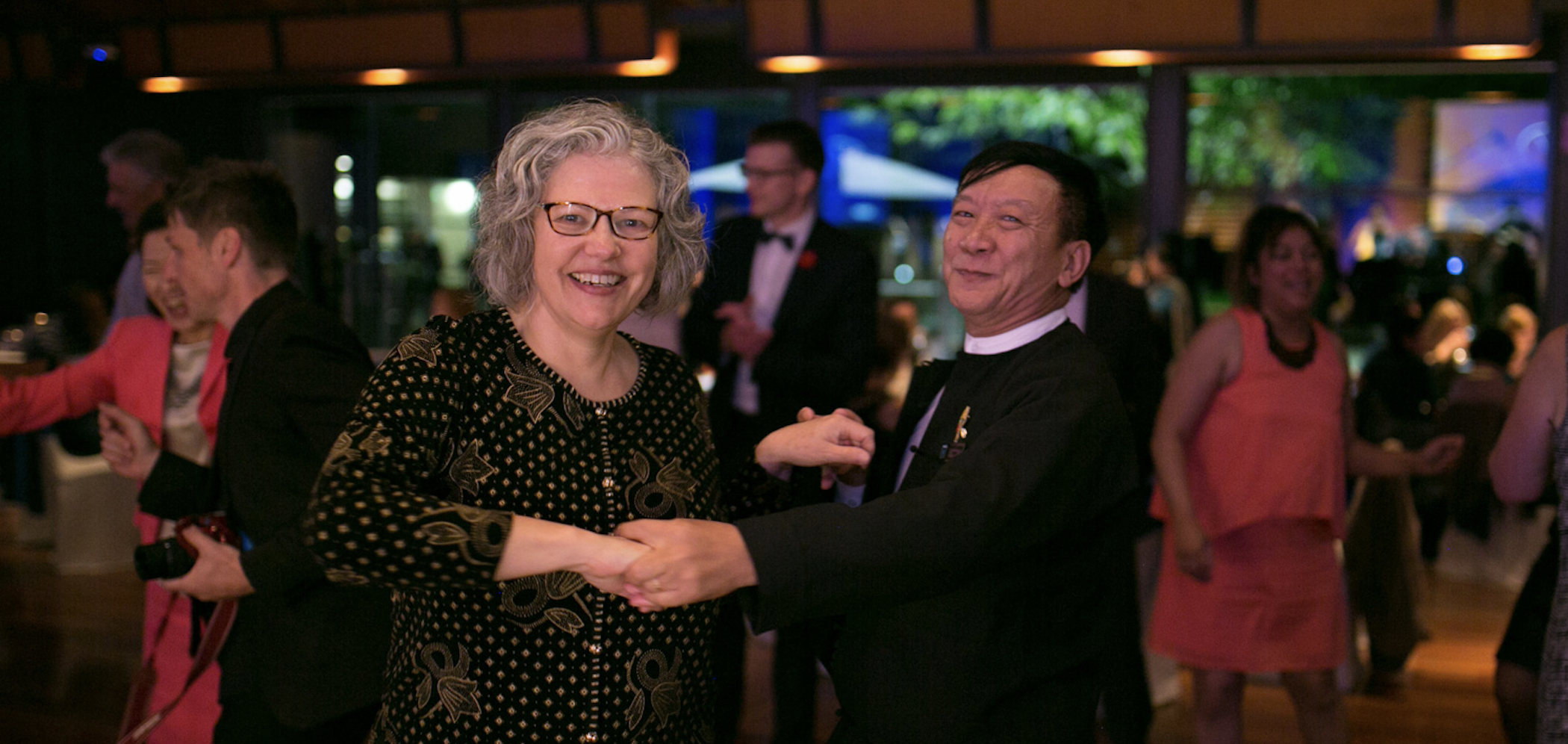 Pam Fletcher dances with JBI Collaboration friends