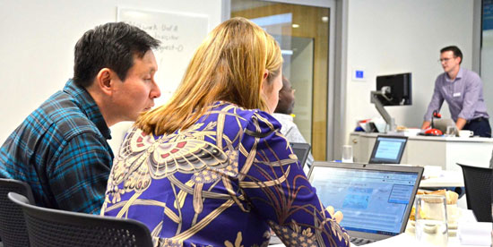 Two students attending a Grade Australia Workshop