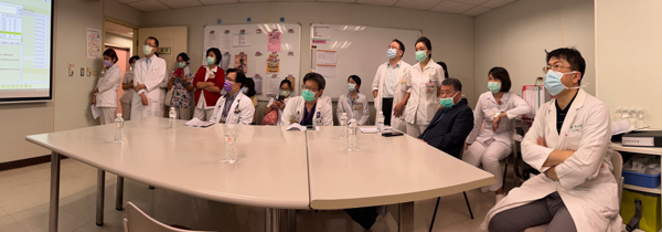 Clinicians watch a presentation about sleep care in breast cancer patients