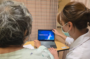 Clinician shows a patient a video about sleep care