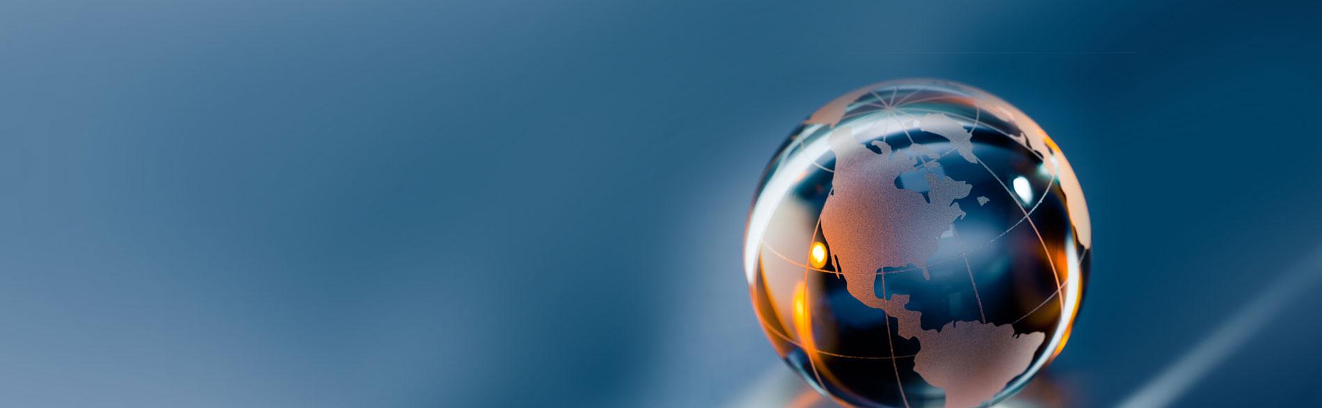 Small glass globe on a blue background