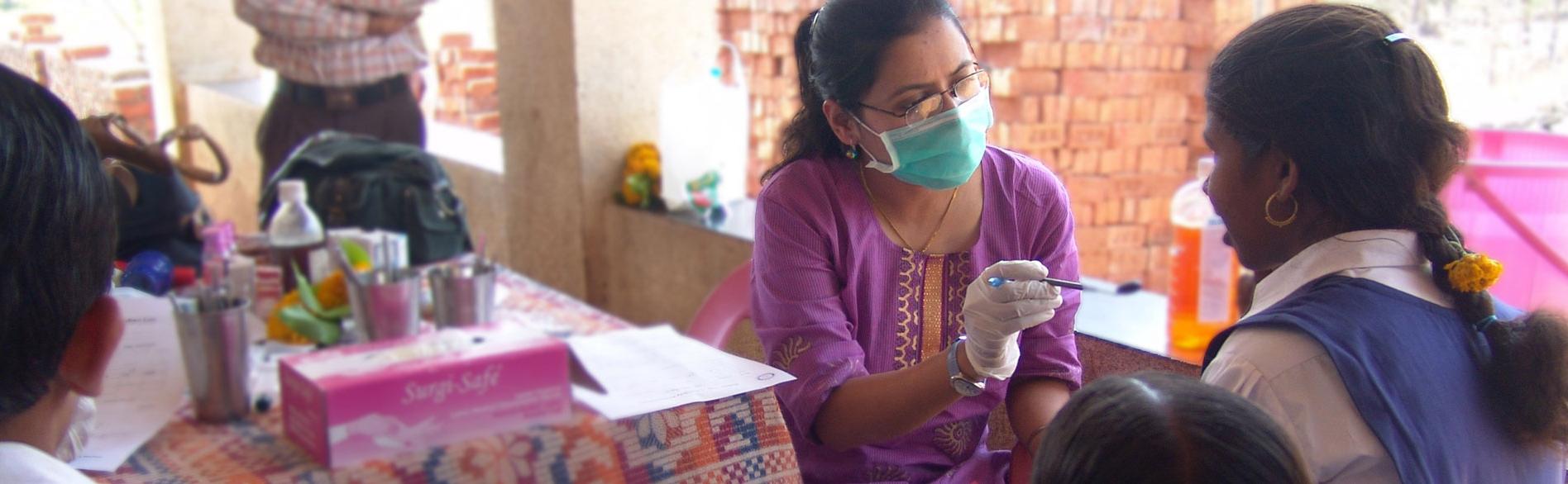 Clinician examining a patient in a outdoor setting